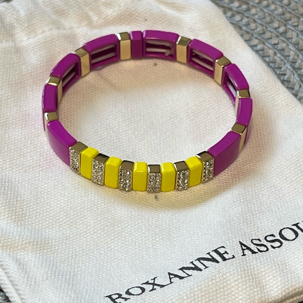 Roxanne Assoulin Enamel coated stretch bracelet with a gold tone logo